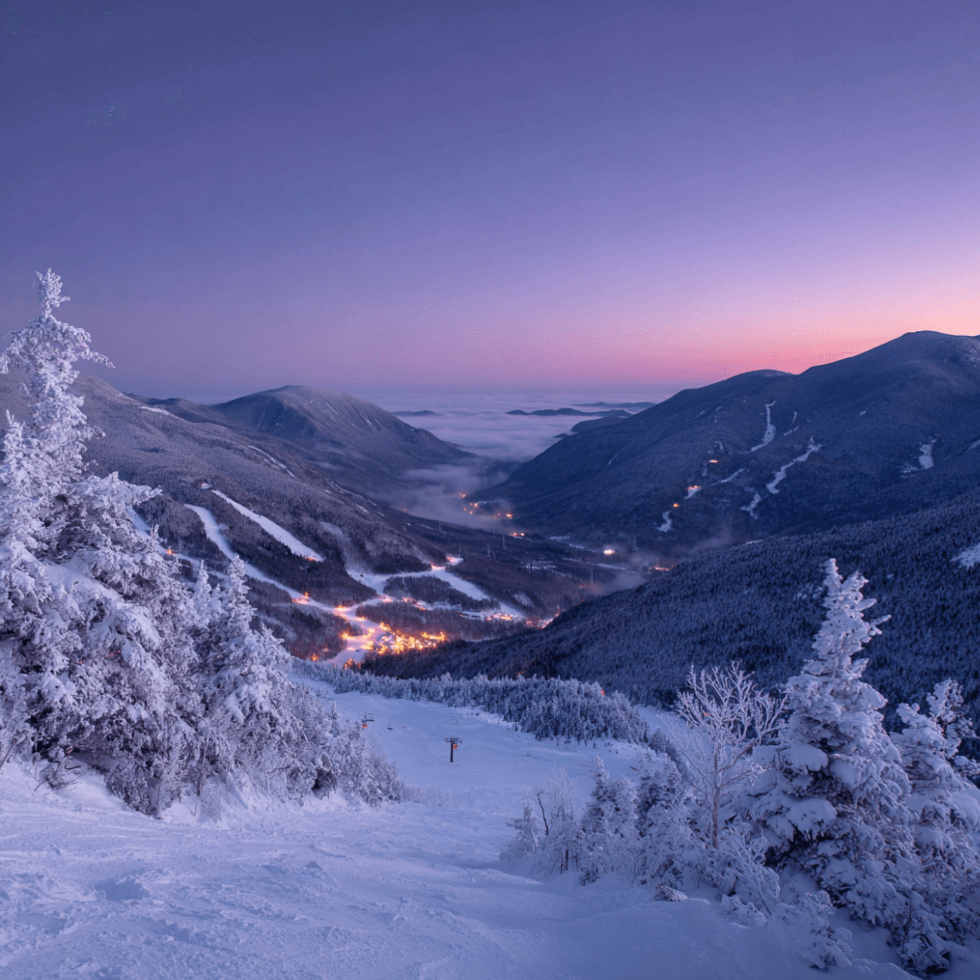 Winter dusk over the White Mountains with soft pink sky