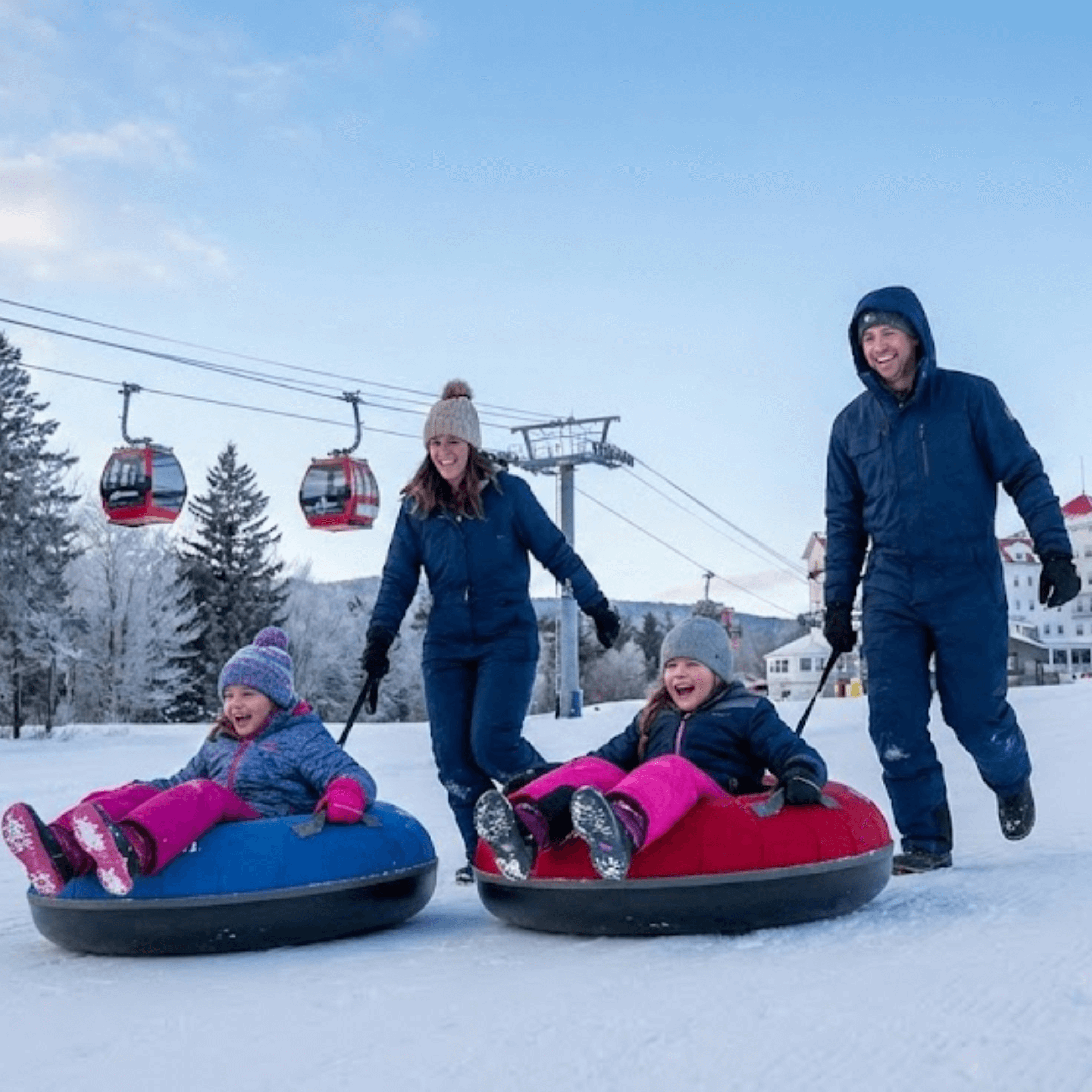 Family snow tubing and enjoying gondola views in Bretton Woods New Hampshire