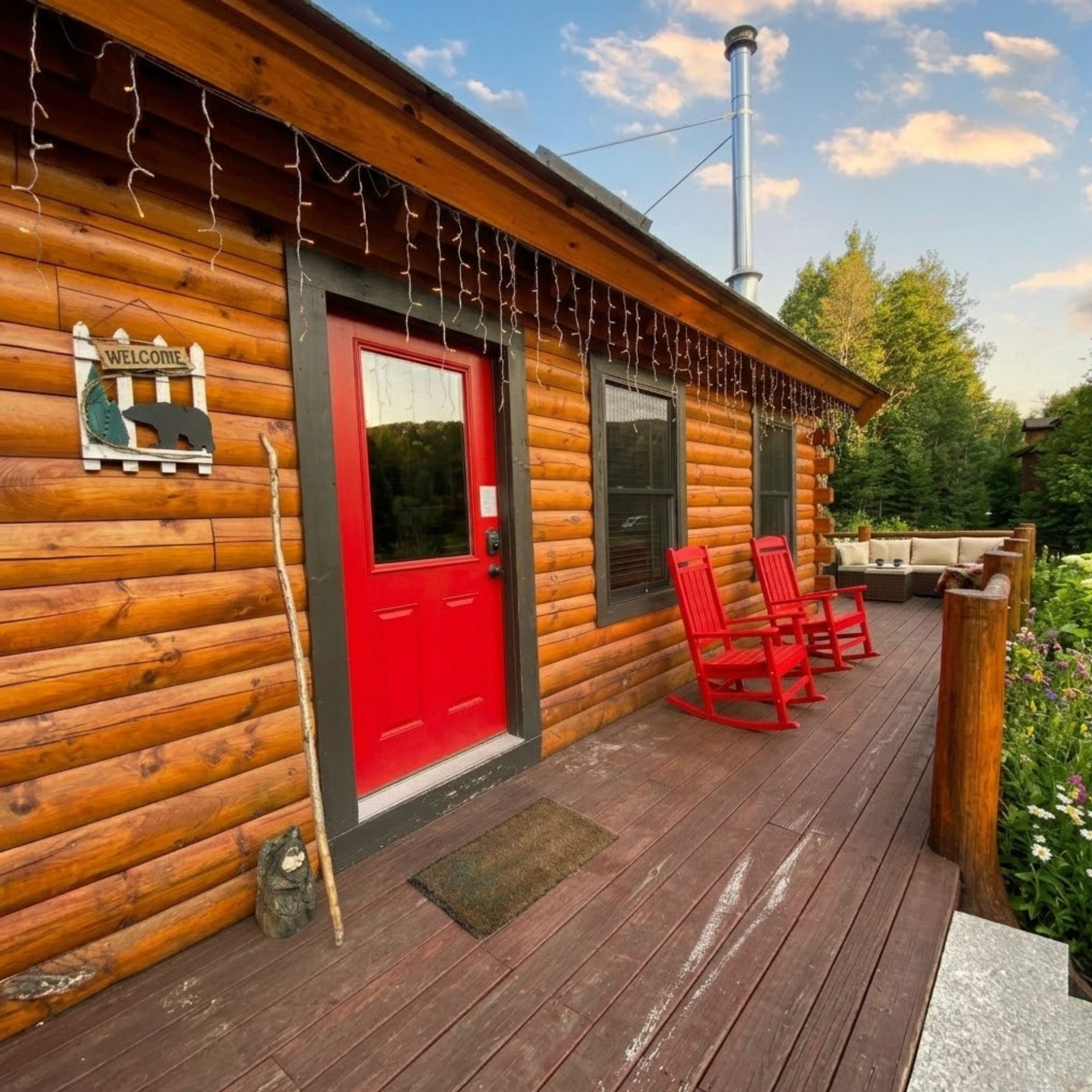 Vacation rental deck with river view framed by brilliant fall foliage and White Mountains ridgeline in background 